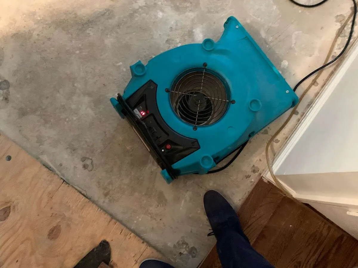 Air mover drying subfloor during Leak Detection & Repair in Lawndale