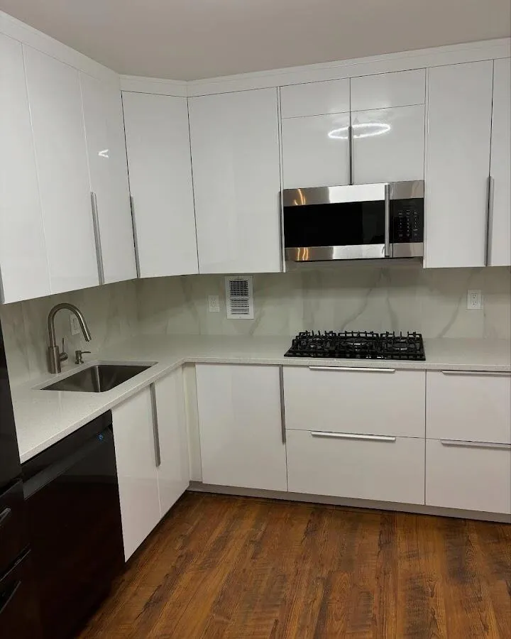 Restored kitchen with white cabinets after water damage in Lawndale